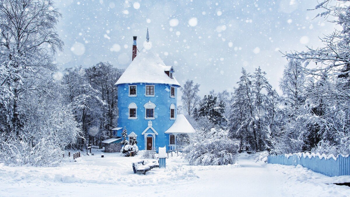 A blue house in a snow scene