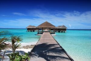 Maldives pier and huts on the sea