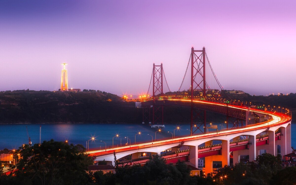 A suspension bridge at night in Portugal