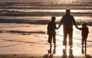 A digital nomad family on a beach