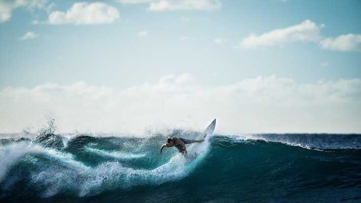 Surfers in weaving moment