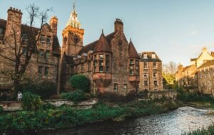 a castle looking over a river in edinburgh, Scotland