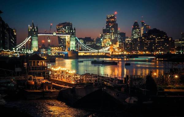 London at night time with a river running through it