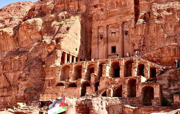 Petra from the side angle, looking at the carvings carved into the rose coloured cliffs. 