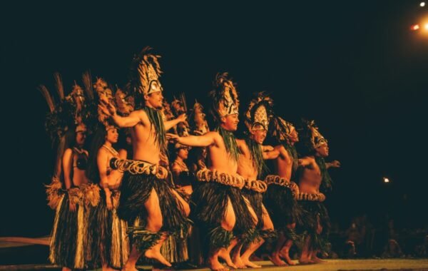 Traditional Hawaiian dancers performing in elaborate costumes during a cultural celebration, showcasing the rich heritage and vibrant spirit of Hawaii