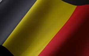 Close-up of the Belgian flag showcasing its iconic vertical stripes of black, yellow, and red, symbolizing the country's national identity